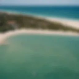 Aerial view of Cabarette Beach showcasing kiteboarders in action