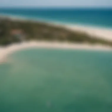 Aerial view of Cabarette Beach showcasing kiteboarders in action