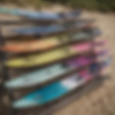 Various types of Cabrinha boards displayed on a rack.