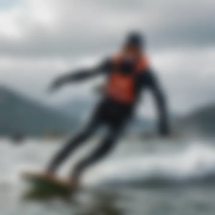 A kiteboarder riding on cold waters, demonstrating the importance of proper insulation