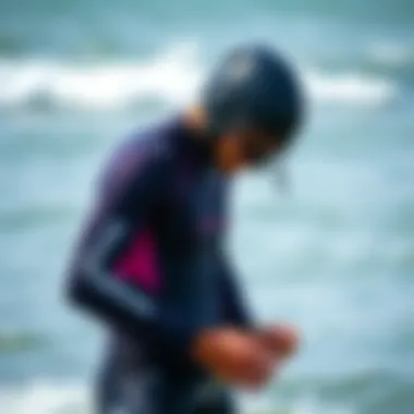 Kiteboarder performing maintenance on their wetsuit