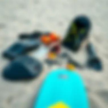 Essential kitesurfing gear laid out on a sandy beach, highlighting the equipment needed.