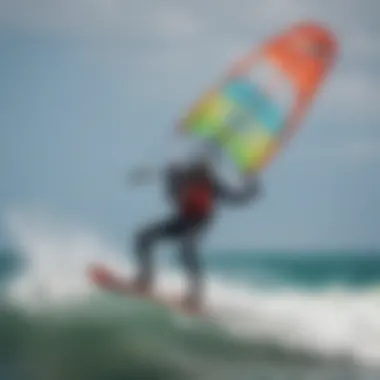 Kiteboarder gliding over the waves with a vibrant kite