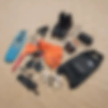 Essential kiteboarding gear laid out on the sand