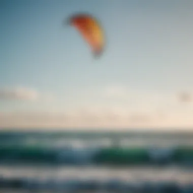 A vibrant kite soaring above clear blue waters