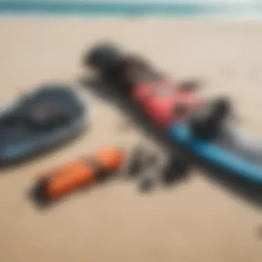 Kiteboarding equipment laid out on the sandy beach