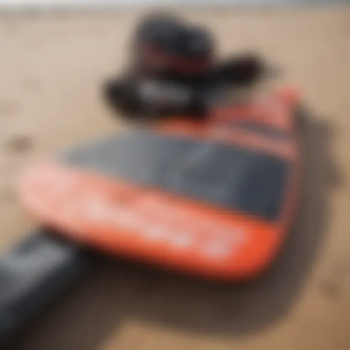 Close-up of essential kite surfing gear laid out on the beach