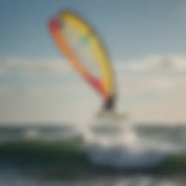 A skilled kite surfer gliding over the waves with a vibrant kite