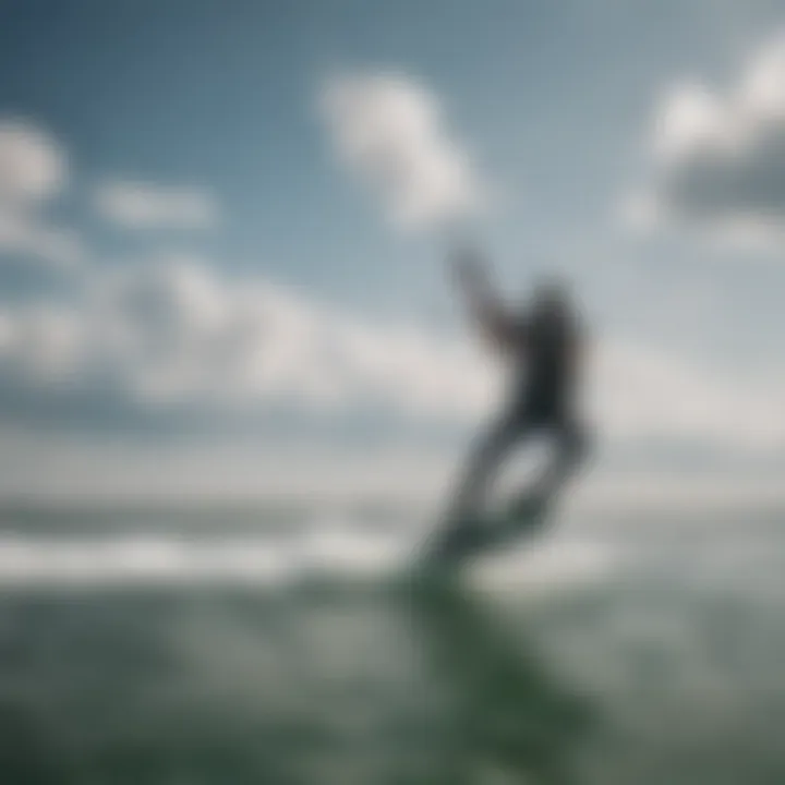 Kiteboarder riding on calm waters under a clear sky