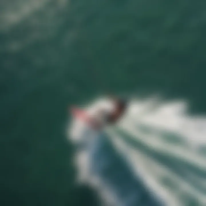 A stunning aerial view of a kiteboarder navigating the waves