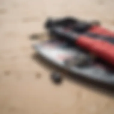 Kiteboarding gear laid out on the sand