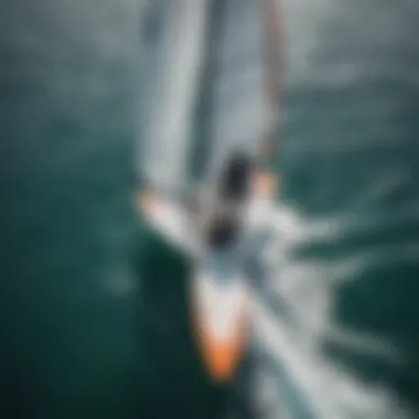 Aerial view of a hydrofoil sail board rider mastering techniques