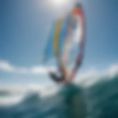 A windsurfer catching a strong gust of wind on a vibrant blue ocean