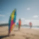 A colorful collection of kitesurf kites displayed on the beach