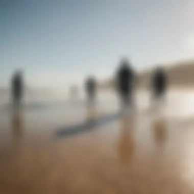 Group of kiteboarding enthusiasts discussing gear in a scenic beach setting