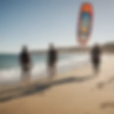 A group of kiteboarders sharing experiences on the beach, reflecting community and camaraderie.