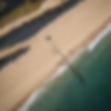 Aerial view of a kitesurfer performing a slingshot jump