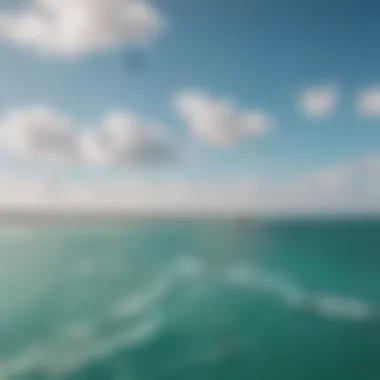 An aerial view of kite surfers gliding over the azure waters of Miami, illustrating the sport's dynamic nature.