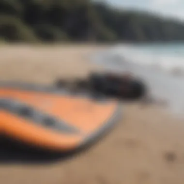 Close-up of kite surfing equipment laid out on the beach