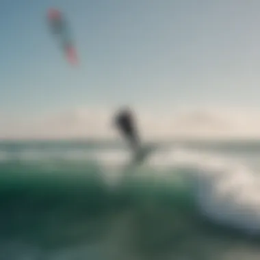 Kite surfer gliding over the ocean waves