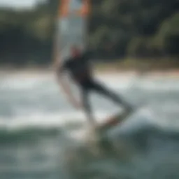 A kite surfer gliding over the waves