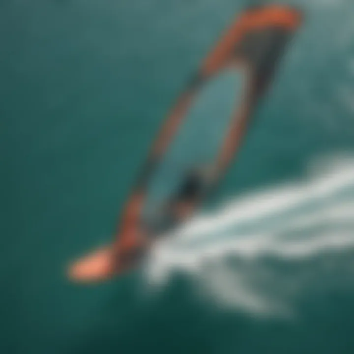 An aerial view of a kiteboarder utilizing the duotone foil wing on the water.