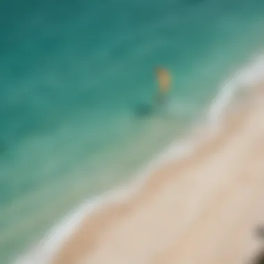 An aerial shot showcasing the vibrant beaches of Aruba with kitesurfers in action