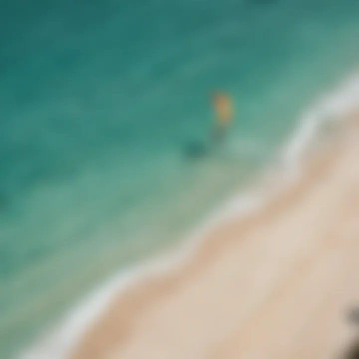 An aerial shot showcasing the vibrant beaches of Aruba with kitesurfers in action