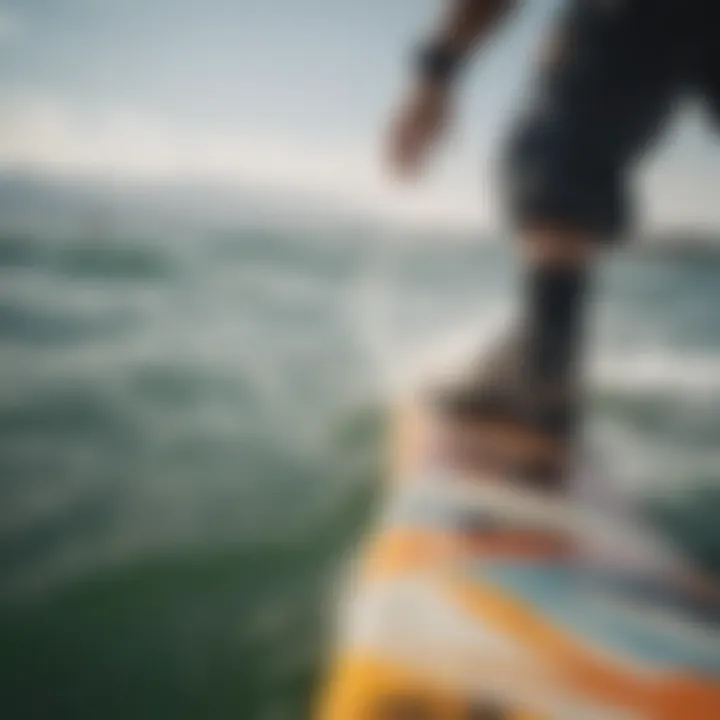 A close-up view of a kiteboarder's feet on the board, illustrating the balance and control required in the sport.