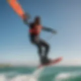 A stunning kiteboarding action shot showcasing a rider soaring above the waves with a vibrant kite.