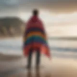 A vibrant changing poncho displayed against a scenic beach background