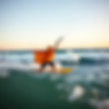 An action shot capturing a kiteboarder wearing a mystic surf poncho amid waves