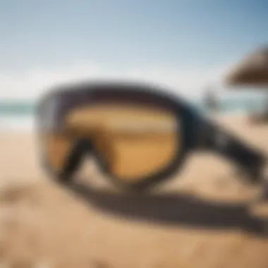 Kitesurfing gear with sunglasses on a sandy beach