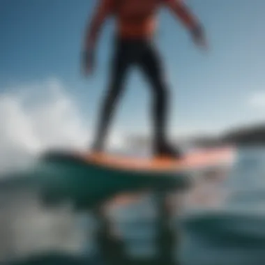 Dynamic action shot of the Armstrong foilboard in use on the water