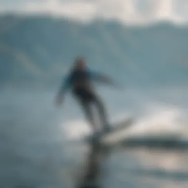 Kiteboarder gliding over water with a used foil board