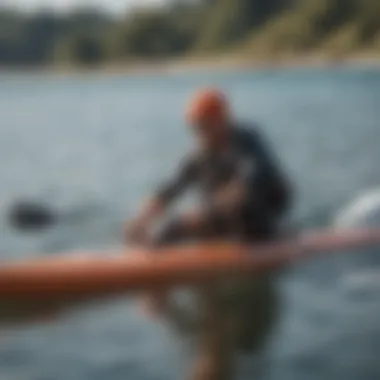 Close-up of essential supwinder gear including kite and paddleboard